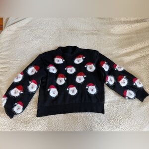 Brand new, never worn, Festive Black Sweater with Santa Faces from Krush Kandy